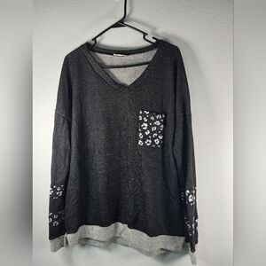 Elegant Black V-Neck Sweatshirt with Patterned Accents